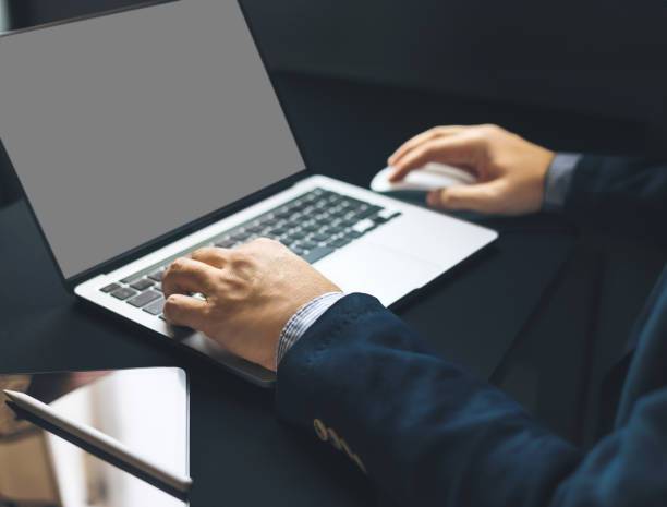 istock Business man hand typing on laptop computer on office table, close up 1625334731