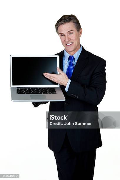 Mature Man Showing A Laptop Computer Stock Photo - Download Image Now - 50-54 Years, 50-59 Years, Administrator