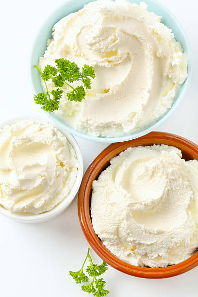 Selection of cream cheese in ceramic dish with a garnish 