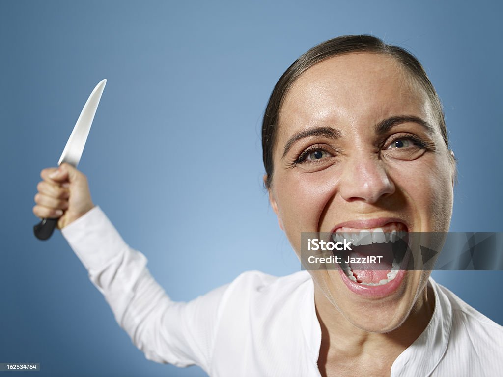 Angry Businesswoman with a knife Adult Stock Photo