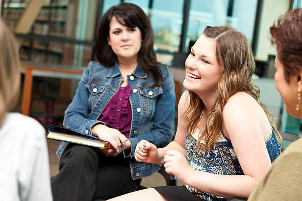 istock Happy teenager in a group discussion setting 162535715