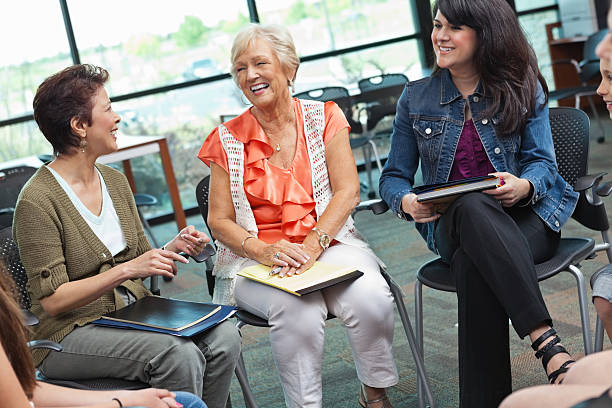 istock Women laughing together in a meeting 162536142