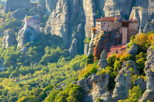 Meteora monasteries. Unique  Panoramic view on the Roussanou Monastery  placed on the edge  of high rock. The Meteora area is on UNESCO World Heritage. Greece, Europe