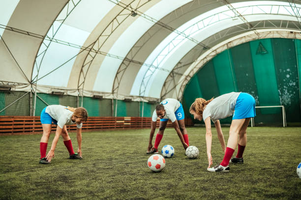 istock Female soccer players warming 1625381932
