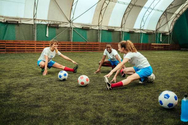 istock Female soccer players warming 1625382686