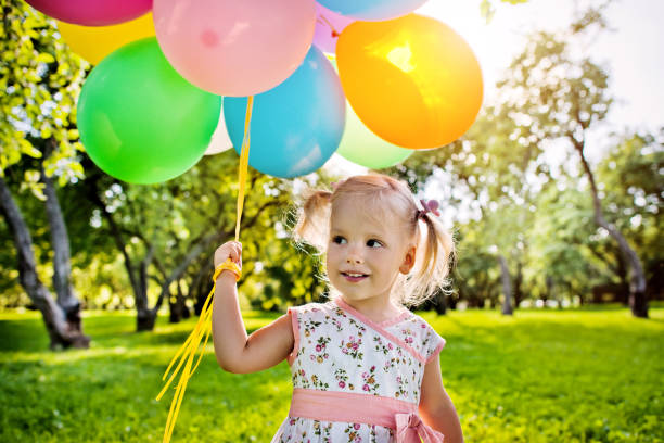 istock Cute girl with balloons 162538382