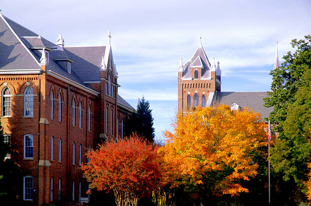 College campus during fall with changing trees stock photo