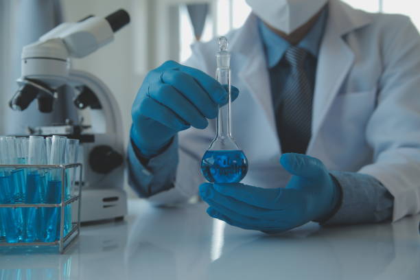 istock biochemical research scientist team working with microscope for coronavirus vaccine development in pharmaceutical research labolatory, selective focus 1625423761
