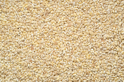 Pearl barley grain seeds texture for background