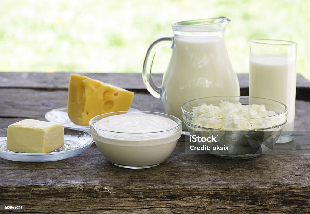 Dairy products on wooden table Dairy products on wooden table, selective focus, shallow deep of field Breakfast Stock Photo