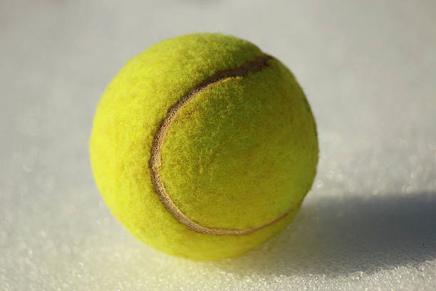 istock Tennis ball on snow 162545054