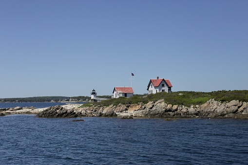 View of Rams Island Lighthouse Casco Bay from the Atlantic Ocean on a cloudless summer day