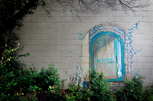 Nashville, Tennessee, USA - June 30, 2023: A mural of a door and rabbit in a small lot near the down district.