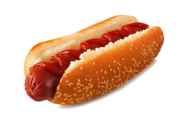 istock Hot dog with ketchup in a sesame seed bun isolated on white 1625455285