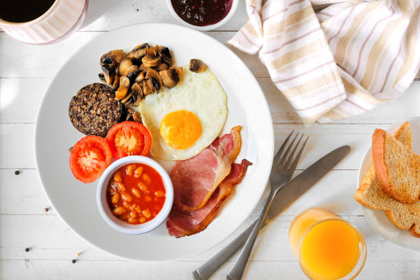 istock Full Scottish breakfast with haggis, table scene over white wood 1625455286
