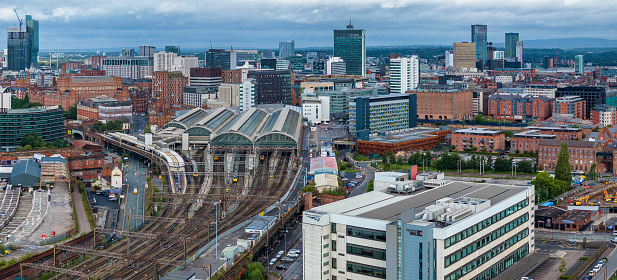 Aerial footage of Manchester Piccadilly train station taken from the east site.
