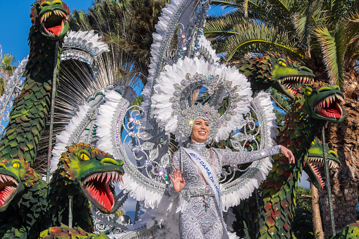 Tenerife, Canary Islands - February 25, 2023: Aspiring queen of Carnival in a float parading through the tourist city of Puerto de la Cruz
