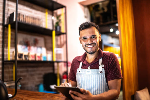 istock Portrait of young man using digital tablet at a coffee shop 1625510970