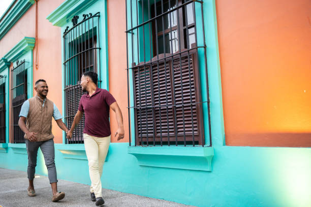 istock Gay couple walking at the historic district 1625517818