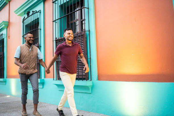 istock Gay couple walking at the historic district 1625518323