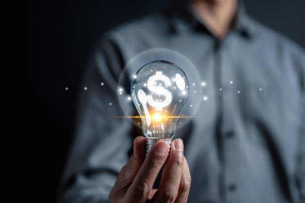 istock Man hand holding lightbulb start new idea make money in business and learning educate and graduation concept. study knowledge to creative thinking idea and problem solving solution 1625524044
