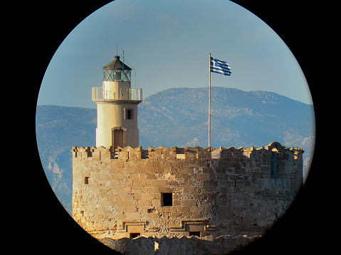 Porthole view of the Rhodes lighthouse