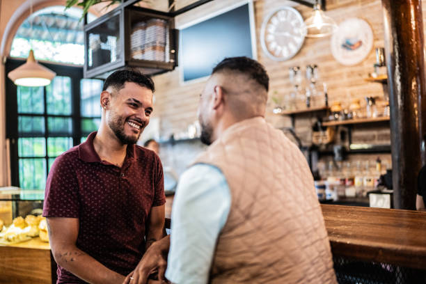 istock Gay couple talking at a coffee shop 1625544233
