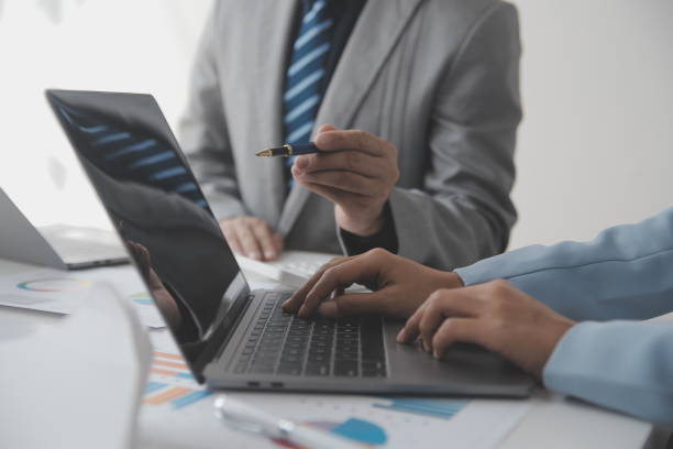 istock Financial analysts analyze business financial reports on a digital tablet planning investment project during a discussion at a meeting of corporate showing the results of their successful teamwork. 1625601689