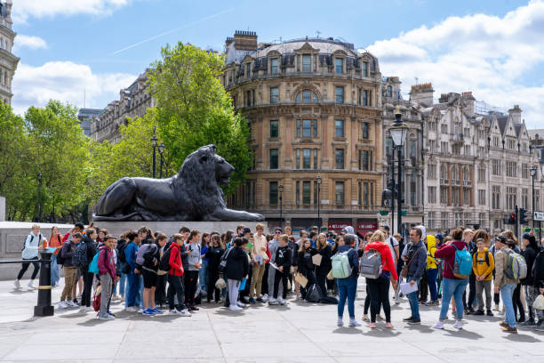 London England - May 29 2023: A Tour Group in Trafalgar Square with Students Sightseeing in London