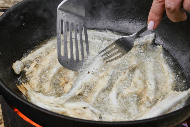 istock Small crispy fish are fried in oil. 1625617694