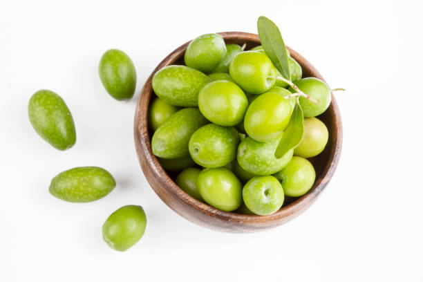 istock Green fresh olive on the white background 1625644485