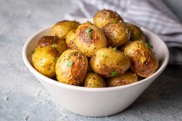 istock Roasted baked baby potatoes with garlic and herbs. 1625706264