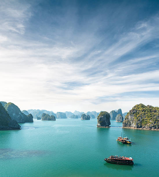 View Of Tourist Boats In Halong Bay, Vietnam Beautiful View Of Halong Bay, Vietnam karst formation photos stock pictures, royalty-free photos & images