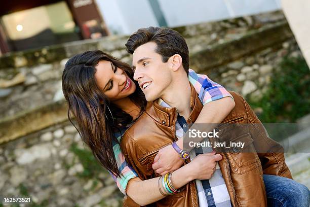 Cheerful Young Couple On A City Street Stock Photo - Download Image Now - Adult, Adults Only, Beautiful People