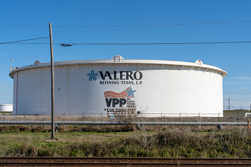 Texas City, TX, USA - March 12, 2022: A Oiltanking sign on the oil tank. Oiltanking is a logistics service provider of tank terminals for petroleum products, chemicals, and gases.