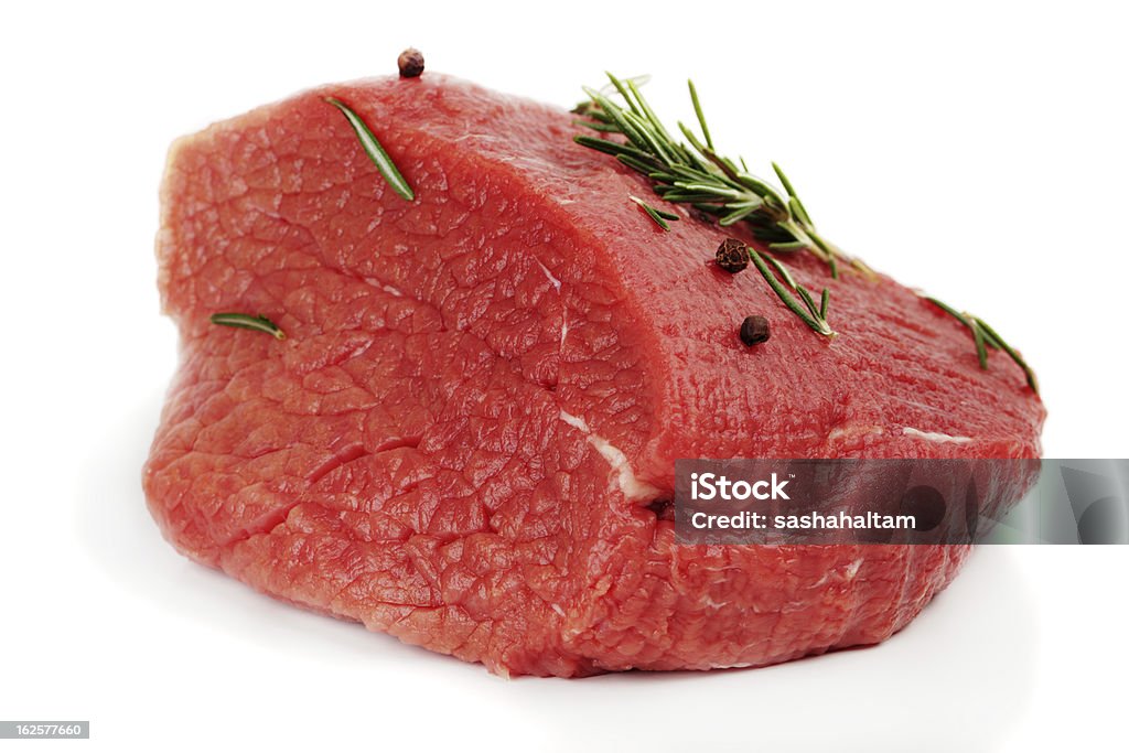 raw meat beef with spices over white, isolated, studio shot Beef Stock Photo