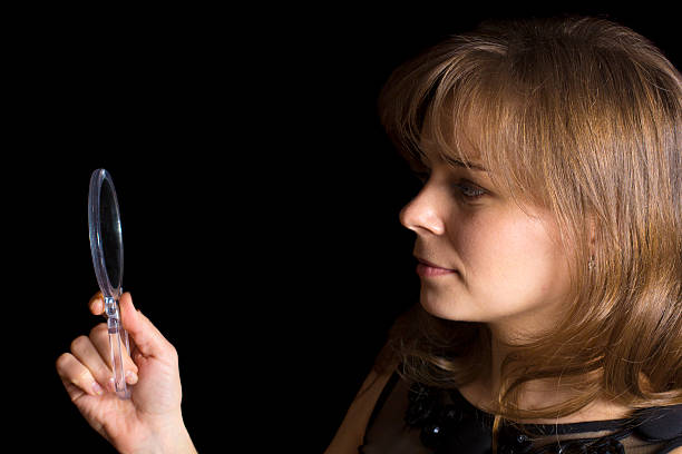 istock Girl looks in a mirror 162577742