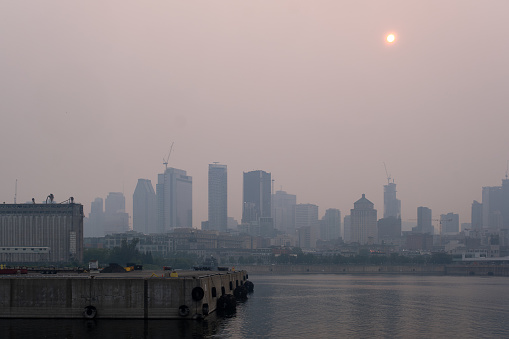 Montreal, CA - 24 June 2023: Montreal Downtown in the smoke of Canadian forest fires