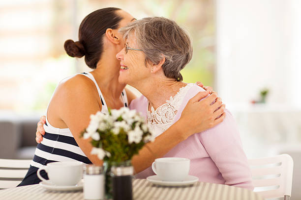 istock young woman hugging senior mother 162578737