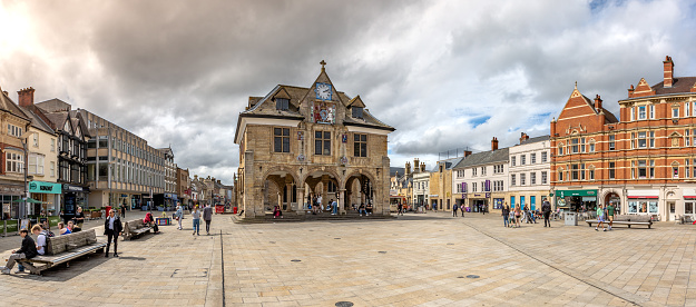 Cathedral Square, Peterborough, UK - August 17, 2023. .  Landscape panorama of historic Guildhall building in Cathedral Square in a Peterborough cityscape skyline