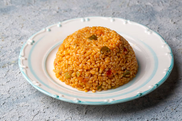 istock Traditional turkish bulgur pilaf with tomato sause in plate (Turkish name; meyhane pilavi) 1625825509