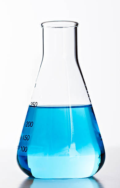 istock Backlit glass laboratory flask filled with blue liquid 162586694