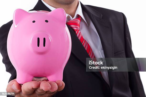 Foto de Empresário E Piggy Bank e mais fotos de stock de Adulto - Adulto, Bem vestido, Brinquedo