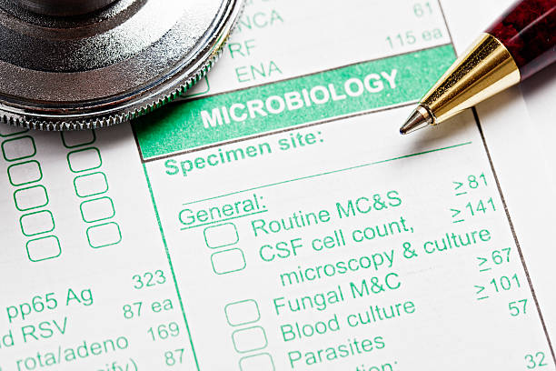 ペンと聴診器に微生物学医療フォーム - medical record doctors office healthcare and medicine claim form ストックフォトと画像