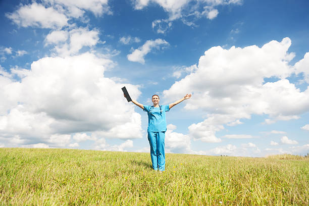 Female doctor standing in a field