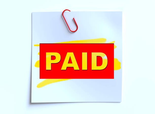 istock Paid word on white paper isolated on white 1625912149