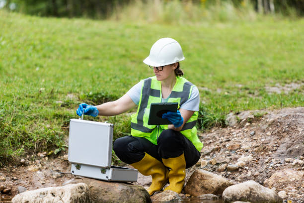 istock Mature woman collected river water sample for analysis 1625954079