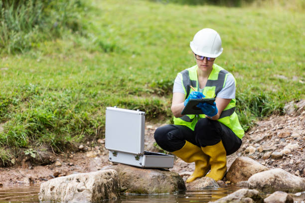istock Mature woman collected river water sample for analysis 1625963815