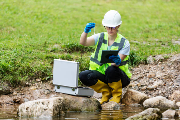 istock Mature woman collected river water sample for analysis 1625967660