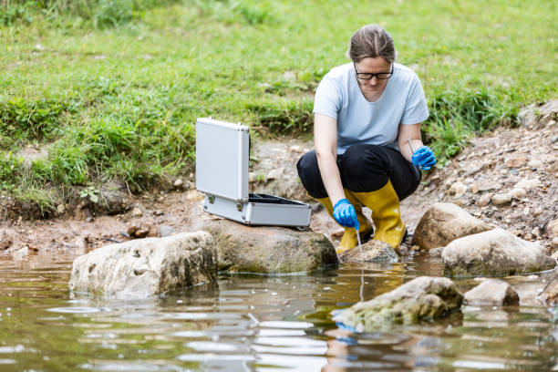 istock Mature woman collected river water sample for analysis 1625969827